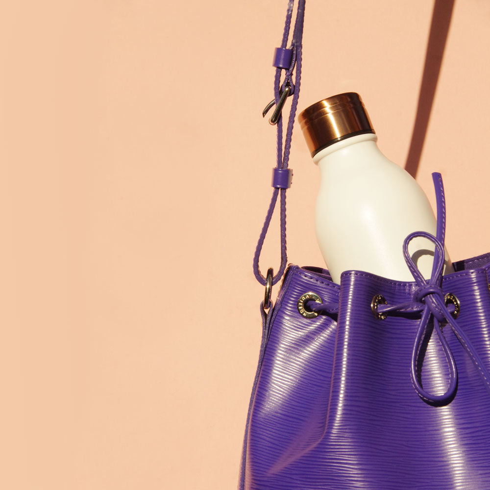 White and copper reusable water bottle